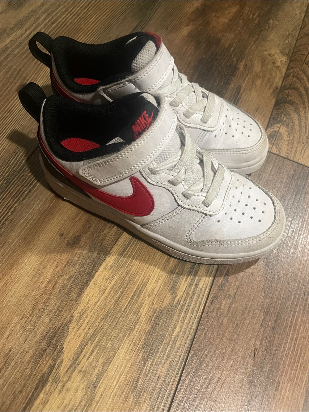 Nike Kids White Sneakers with Red Swoosh